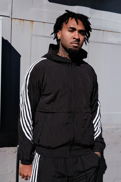 tracksuit, zip up jacket, athletic pants, track jacket, jogging suit, sportswear set, brand awareness, lifestyle, bold, trustworthy, black, neutral